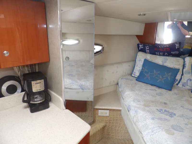 Slide: The Image of Interior cabin of a 2008 Formula 31 Performance Cruiser with bed, coffee maker, and mirror. - 43