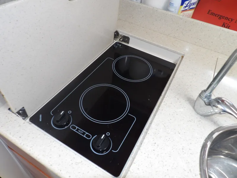 Slide: The Image of 2008 Formula 31 Performance Cruiser electric stove in kitchen area. - 45