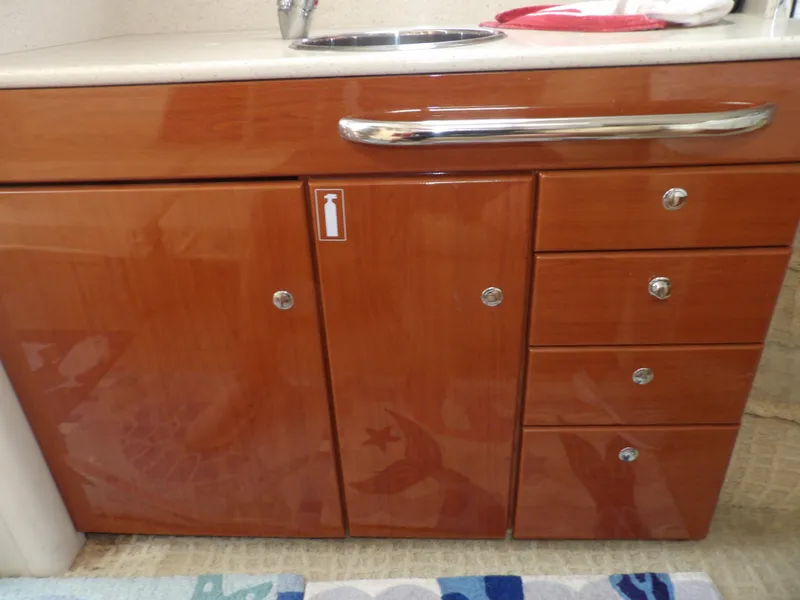 Slide: The Image of 2008 Formula 31 Performance Cruiser bathroom vanity with wooden cabinets and drawers. - 48