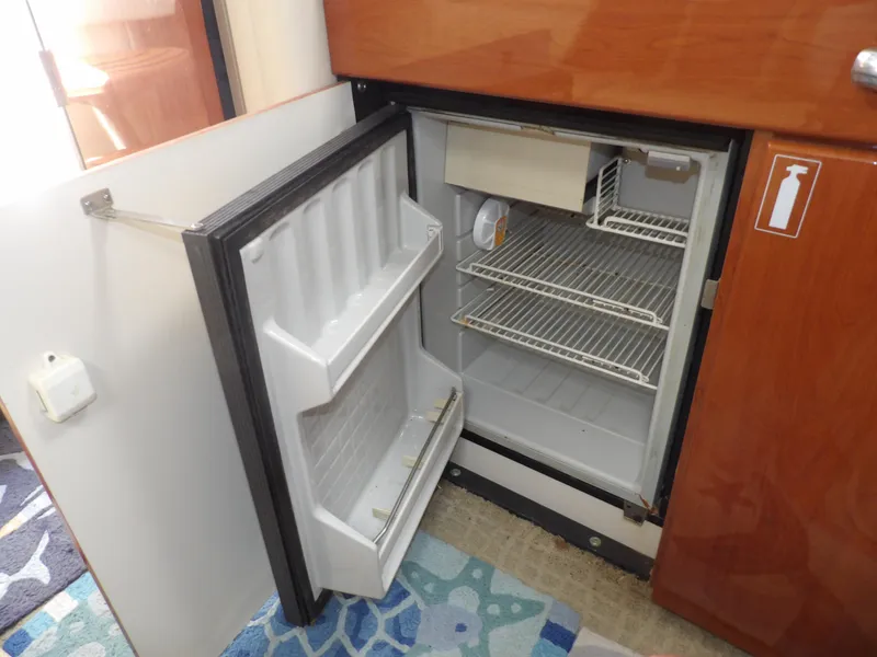 Slide: The Image of Open refrigerator in 2008 Formula 31 Performance Cruiser boat interior. - 49