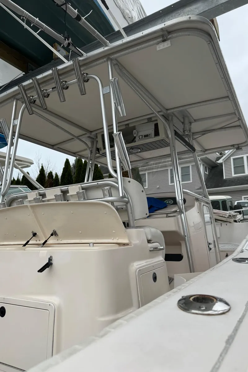 Slide: The Image of 1999 Grady-White 306 Bimini boat with T-top and center console. - 15