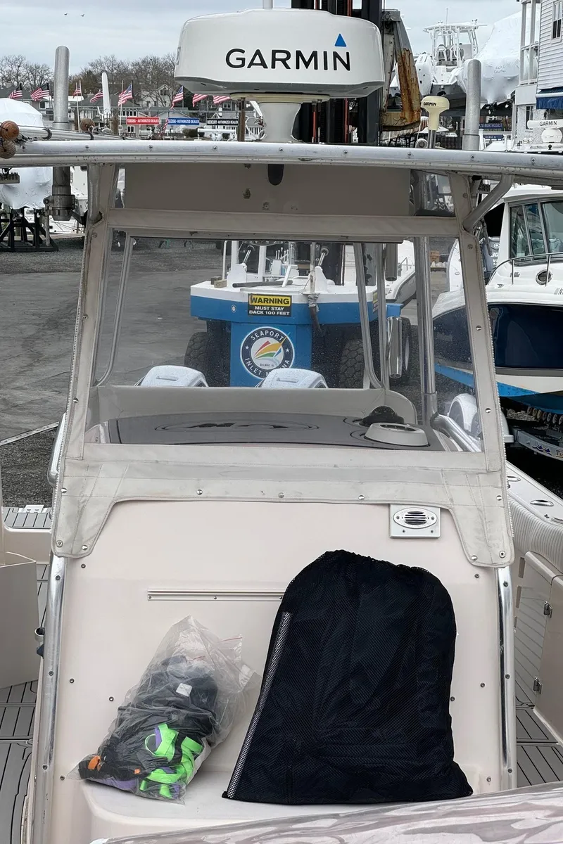 Slide: The Image of 1999 Grady-White 306 Bimini boat with Garmin radar at a marina. - 8
