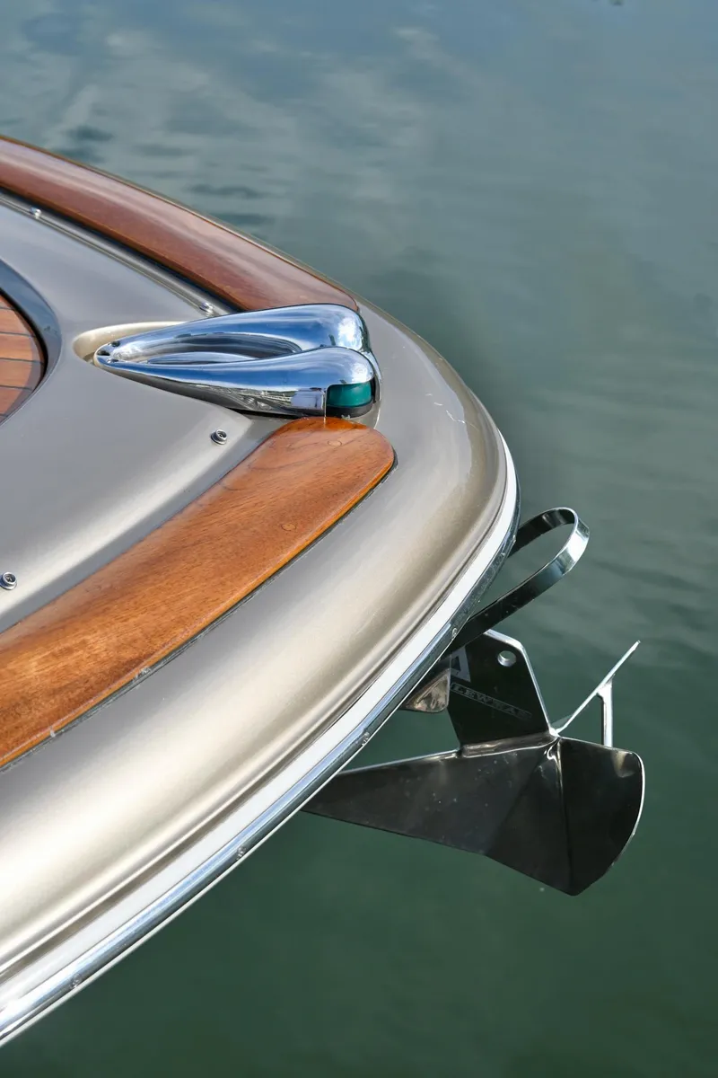 Slide: The Image of 2013 Chris-Craft Launch 32 dashboard with wood steering wheel and Raymarine electronics. - 10