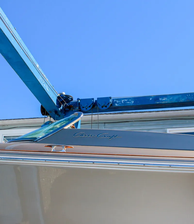 Slide: The Image of 2013 Chris-Craft Launch 32 dashboard with wood trim and logo. - 15