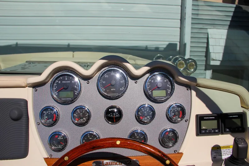 Slide: The Image of Dashboard of 2013 Chris-Craft Launch 32 boat with controls and gauges. - 25