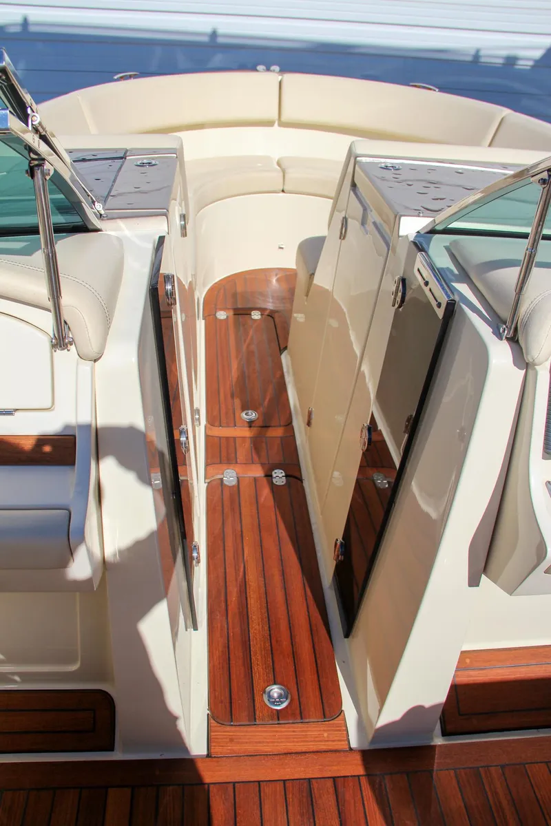 Slide: The Image of 2013 Chris-Craft Launch 32 boat interior with dashboard and steering wheel. - 28