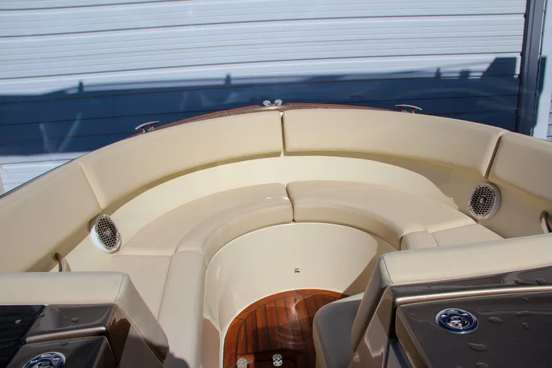 Slide: The Image of 2013 Chris-Craft Launch 32 boat interior with teak flooring and open seating area. - 29