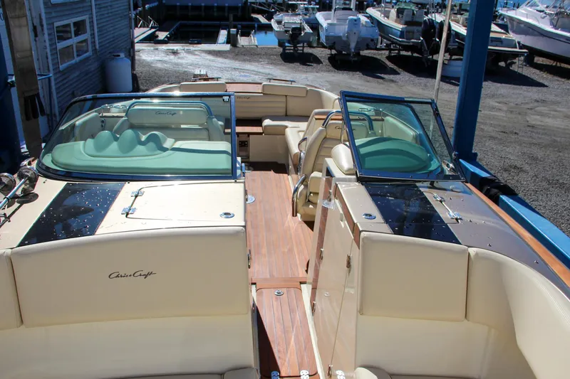 Slide: The Image of 2013 Chris-Craft Launch 32 boat bow with teak wood deck and stainless steel fittings. - 34