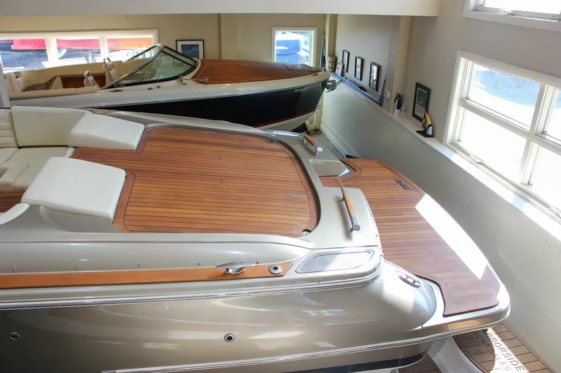 Slide: The Image of 2013 Chris-Craft Launch 32 boat with elegant wooden deck in showroom. - 57