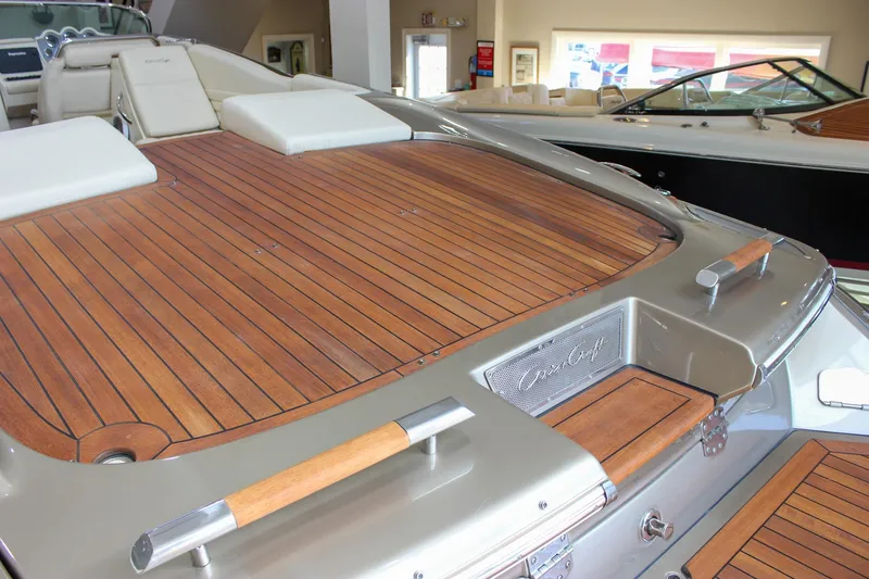 Slide: The Image of 2013 Chris-Craft Launch 32 boat with elegant wooden deck and luxurious seating. - 59