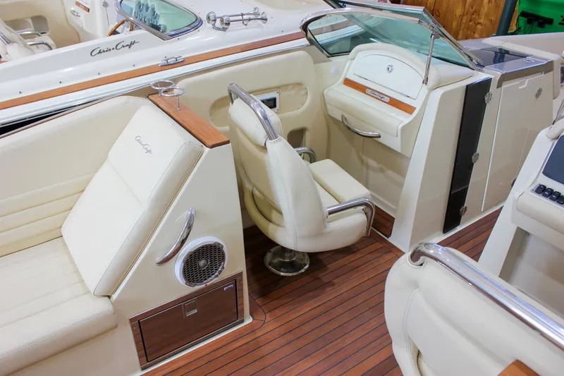 Slide: The Image of 2013 Chris-Craft Launch 32 interior with luxurious seating and elegant wood accents. - 61
