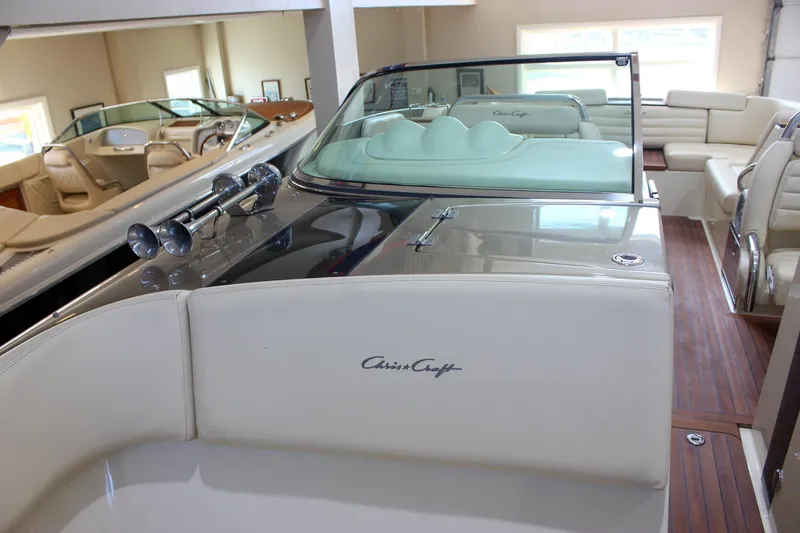 Slide: The Image of 2013 Chris-Craft Launch 32 boat interior with elegant seating and polished wood flooring. - 62