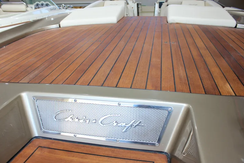 Slide: The Image of 2013 Chris-Craft Launch 32 boat with teak deck and branded metal plate. - 65