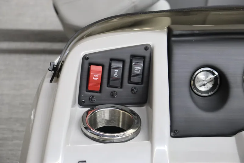Slide: The Image of Control panel of the 2024 Bennington 20 SFNP boat with switches and cup holder. - 19