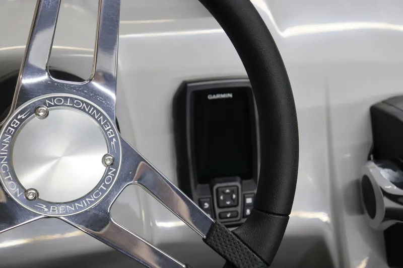 Slide: The Image of 2024 Bennington 20 SFNP steering wheel and Garmin display. - 20