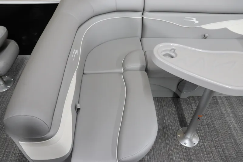Slide: The Image of 2024 Bennington 20 SFNP boat interior with gray seating and table. - 21
