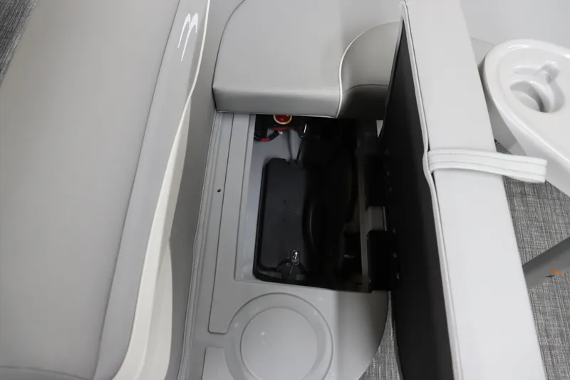 Slide: The Image of 2024 Bennington 20 SFNP boat storage compartment with cup holder and seating. - 22