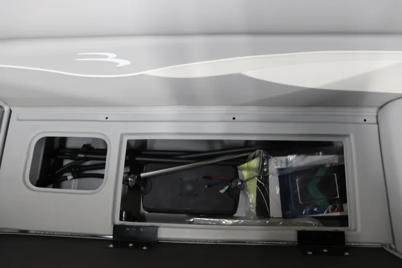 Slide: The Image of 2024 Bennington 20 SFNP storage compartment with boating accessories. - 24