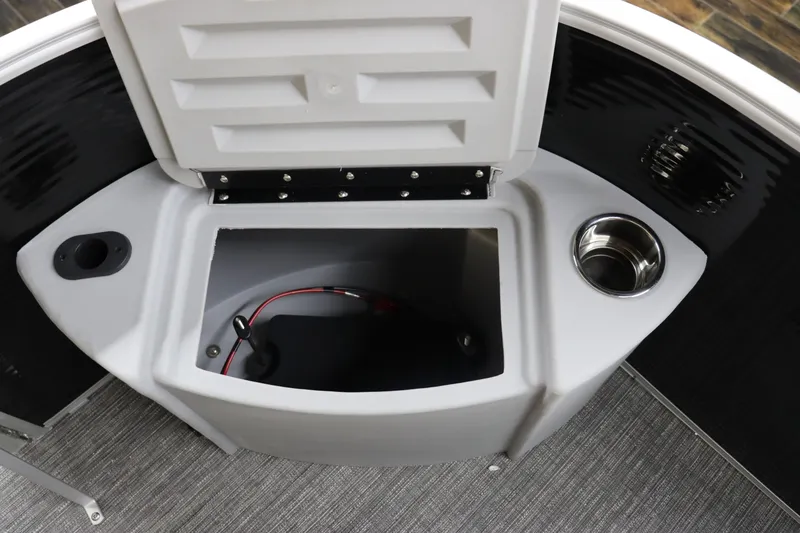 Slide: The Image of 2024 Bennington 20 SFNP boat storage compartment with cup holders and wiring. - 27