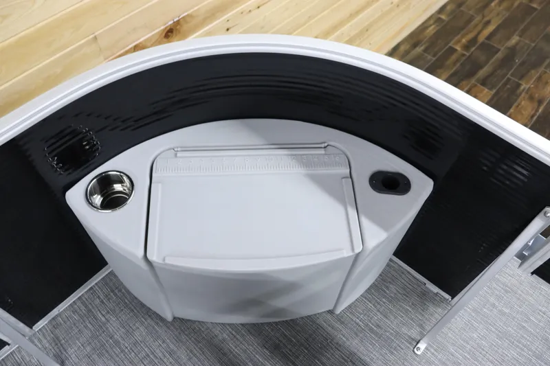 Slide: The Image of 2024 Bennington 20 SFNP boat console with cup holder and storage compartment. - 28