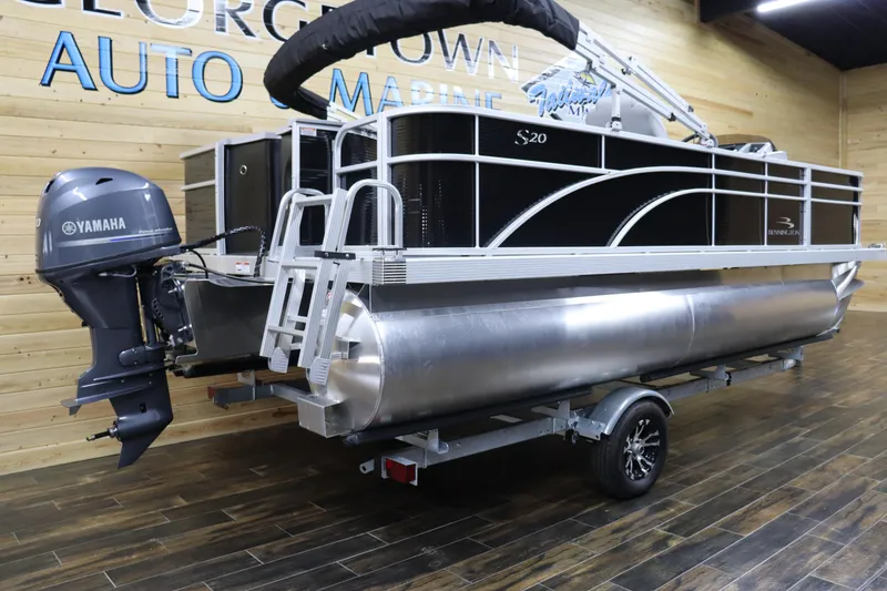 Slide: The Image of 2024 Bennington 20 SFNP pontoon boat with Yamaha outboard motor on trailer. - 3