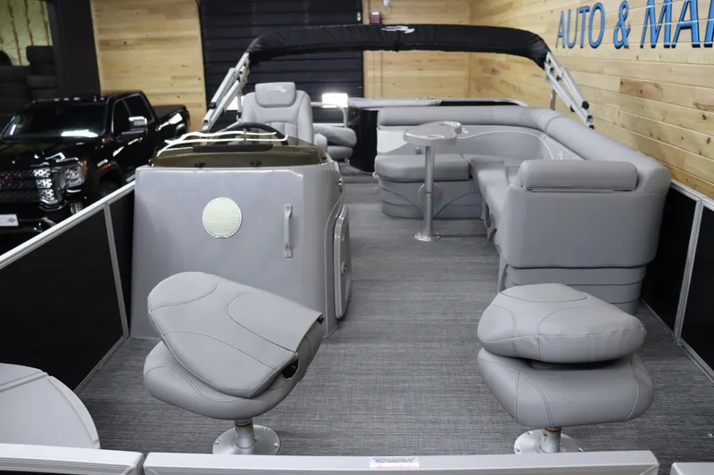 Slide: The Image of 2024 Bennington 20 SFNP pontoon boat interior with gray seating and modern design. - 8