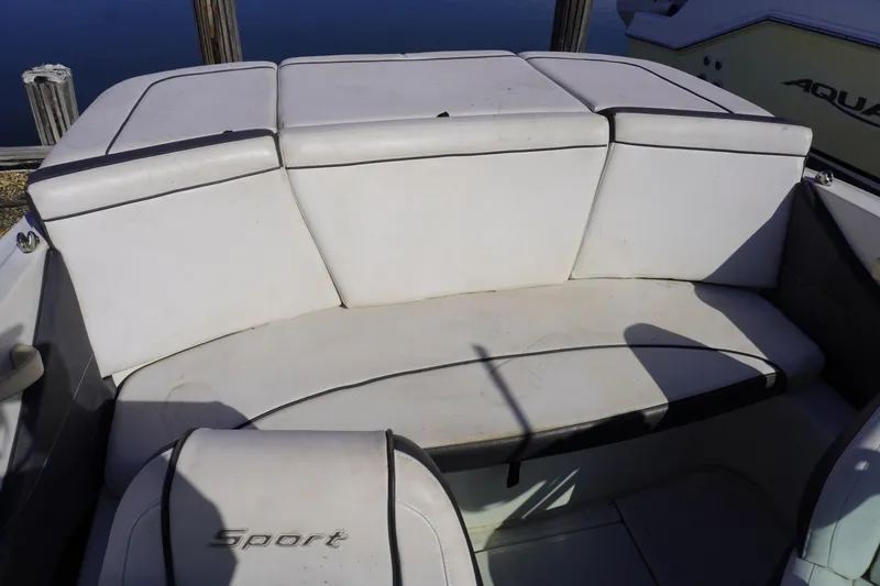 Slide: The Image of 2010 Sea Ray 175 Sport boat interior seating area. - 8