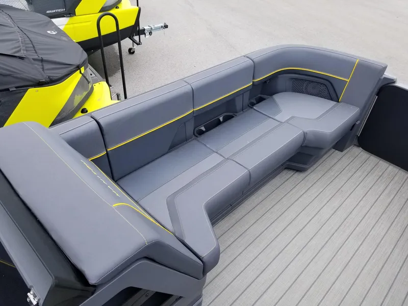 Slide: The Image of 2023 Manitou Explore Navigator 24 with Trifold Bench - SHP575, gray and yellow seating. - 11