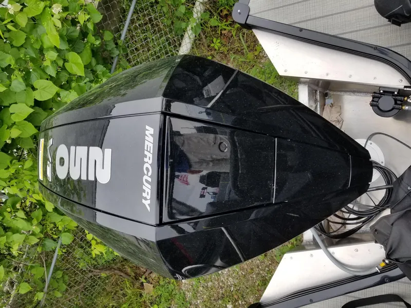 Slide: The Image of 2023 Manitou Explore Navigator 24 with Trifold Bench, SHP575 Mercury engine. - 8