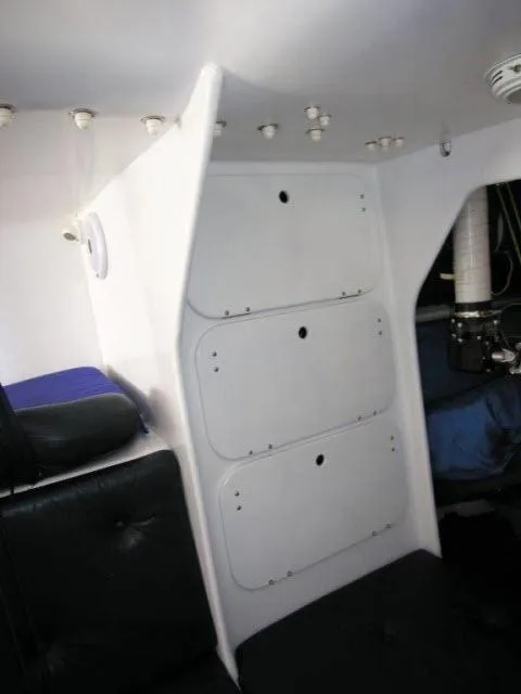 Slide: The Image of Interior of 1993 Green Marine Dubois 50 yacht with white storage compartments. - 12