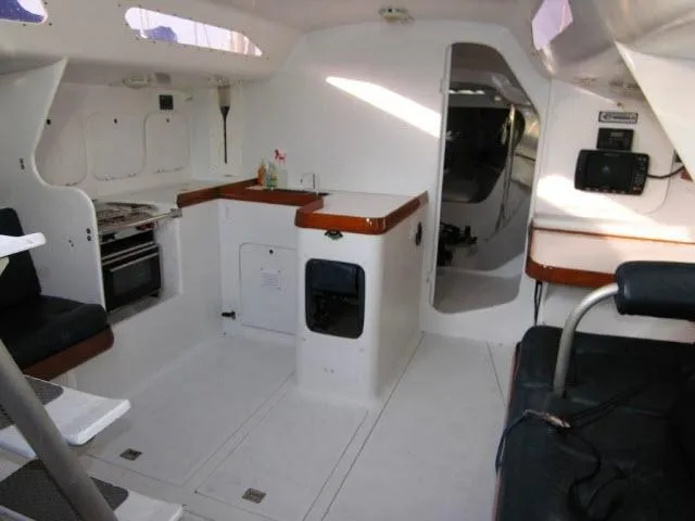 Slide: The Image of Interior of 1993 Green Marine Dubois 50 sailboat with kitchen and seating area. - 14