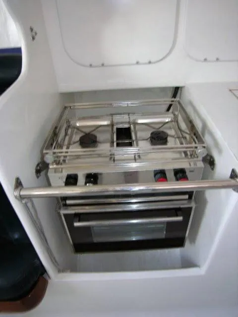 Slide: The Image of Compact kitchen stove and oven in a 1993 Green Marine Dubois 50 yacht. - 16