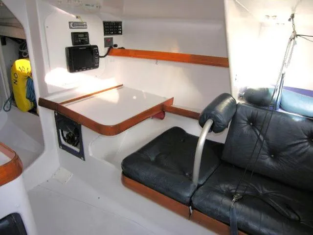 Slide: The Image of Interior of 1993 Green Marine Dubois 50 sailboat with navigation station and seating area. - 19