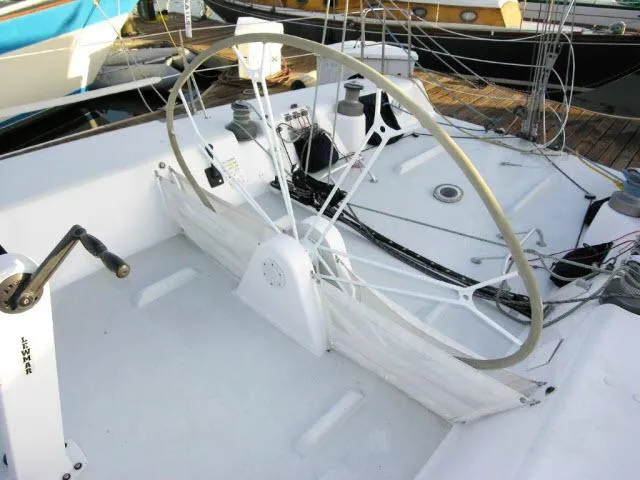 Slide: The Image of Cockpit of 1993 Green Marine Dubois 50 sailboat with steering wheel and winches. - 26