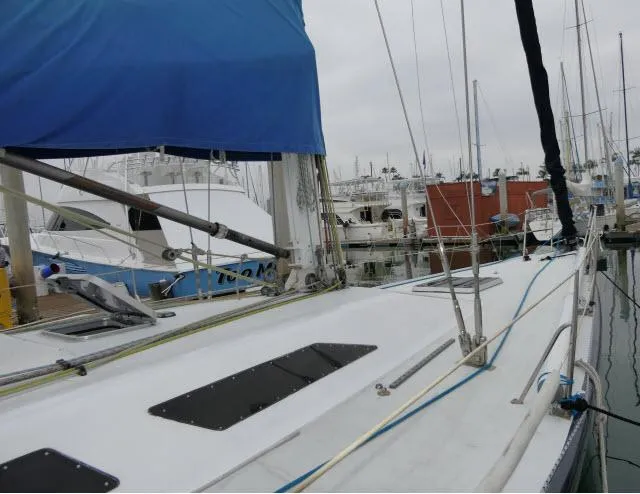 Slide: The Image of 1993 Green Marine Dubois 50 sailboat docked at a marina. - 29