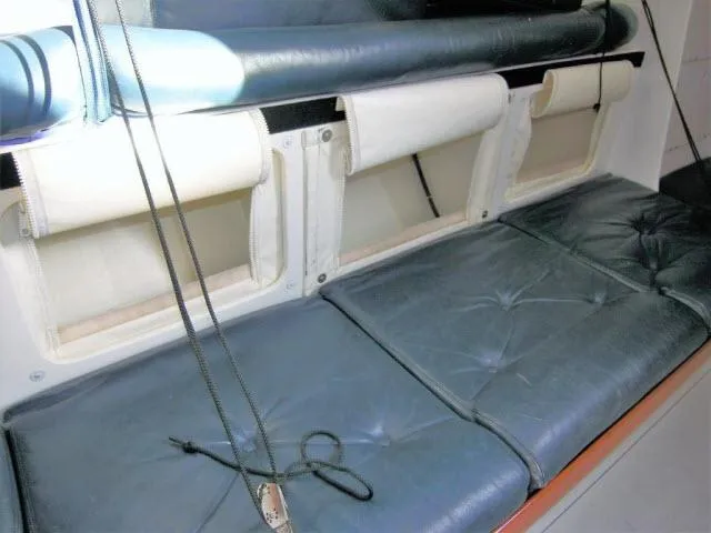 Slide: The Image of Interior seating of 1993 Green Marine Dubois 50 yacht with blue cushions. - 4