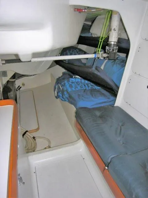Slide: The Image of Interior cabin of a 1993 Green Marine Dubois 50 sailboat with blue cushions. - 7