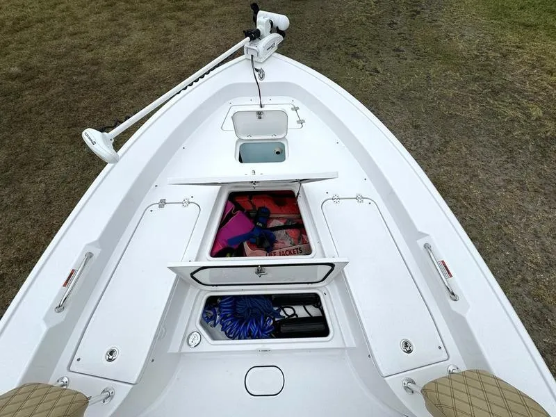 Slide: The Image of 2023 Sportsman Masters 267 Bay boat storage compartments and trolling motor. - 11