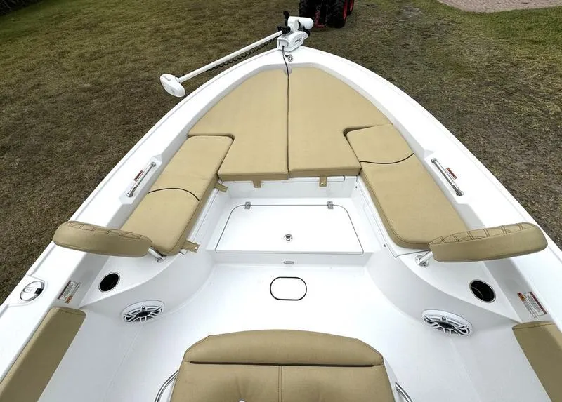 Slide: The Image of 2023 Sportsman Masters 267 Bay boat with cushioned seating and storage compartments. - 14