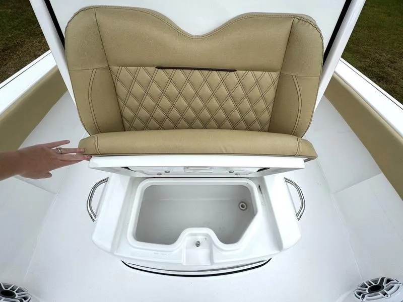 Slide: The Image of 2023 Sportsman Masters 267 Bay boat with cushioned seat and storage compartment. - 19