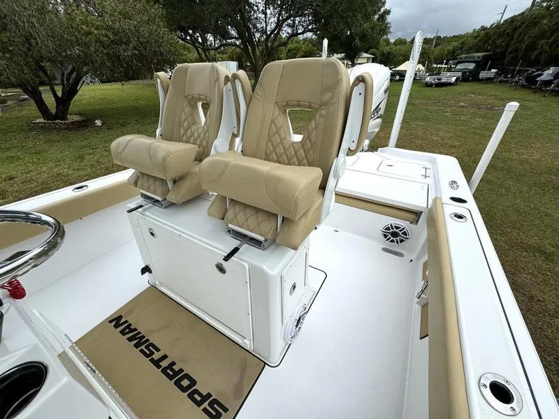 Slide: The Image of 2023 Sportsman Masters 267 Bay boat with beige seating and white deck. - 22