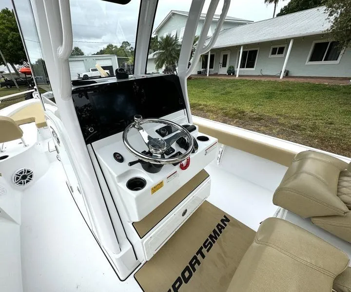 Slide: The Image of 2023 Sportsman Masters 267 Bay boat interior with steering console and seating. - 24