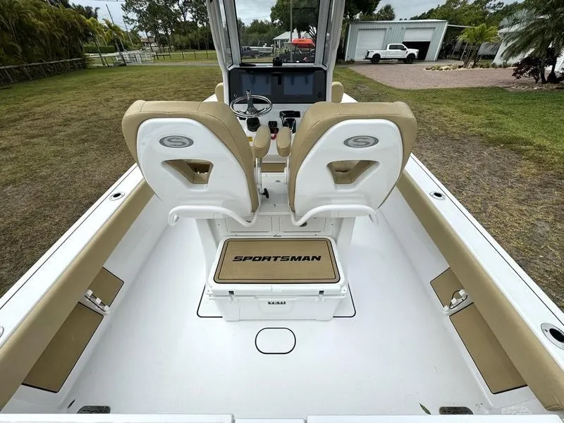 Slide: The Image of 2023 Sportsman Masters 267 Bay boat interior with dual seats and console. - 26