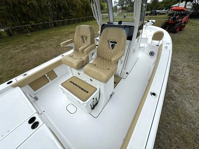 Slide: The Image of 2023 Sportsman Masters 267 Bay boat with tan seats and white deck. - 29