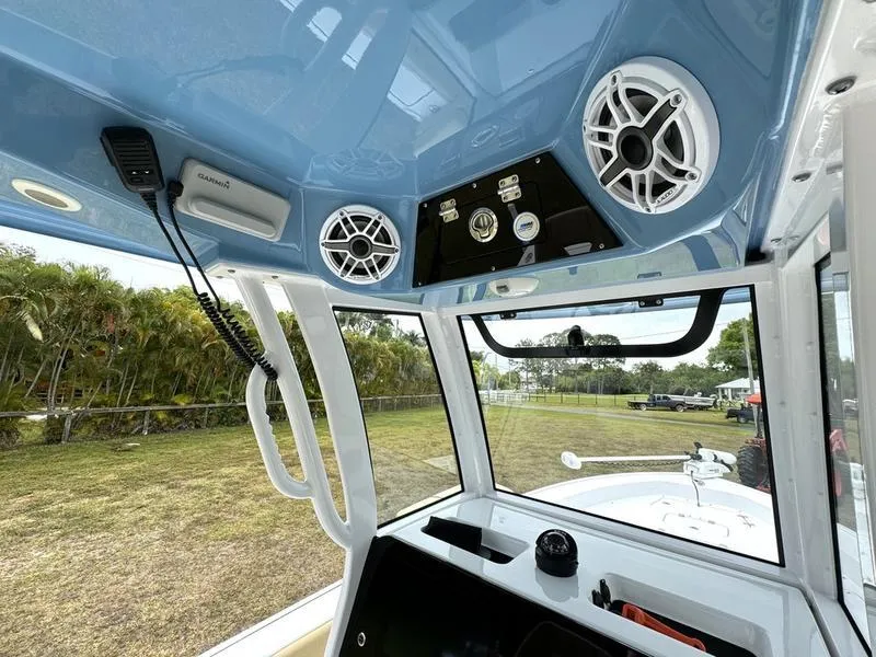 Slide: The Image of 2023 Sportsman Masters 267 Bay boat interior with speakers and control panel. - 32