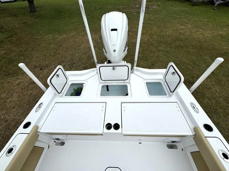 Slide: The Image of 2023 Sportsman Masters 267 Bay boat deck with storage compartments and motor. - 34