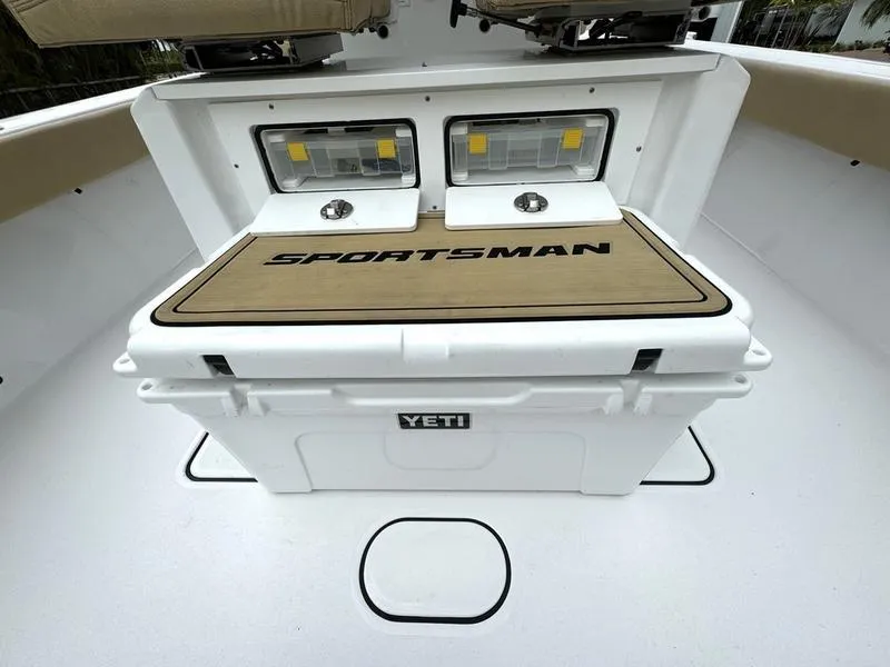 Slide: The Image of 2023 Sportsman Masters 267 Bay boat with Yeti cooler and storage compartments. - 36