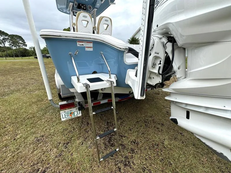 Slide: The Image of 2023 Sportsman Masters 267 Bay boat with ladder and outboard motor. - 8