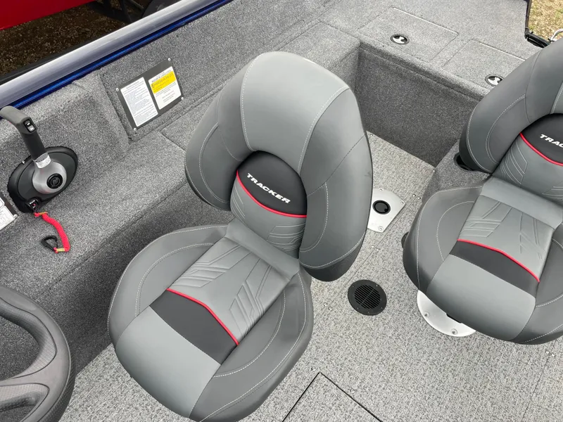Slide: The Image of 2023 Tracker Pro Guide V-175 WT boat interior with gray and black seats. - 10
