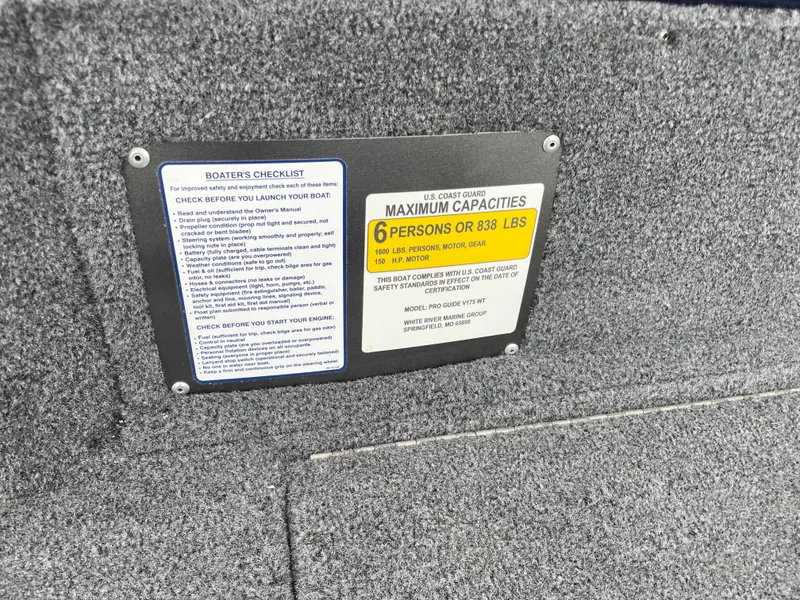 Slide: The Image of 2023 Tracker Pro Guide V-175 WT boat capacity and safety checklist labels. - 11